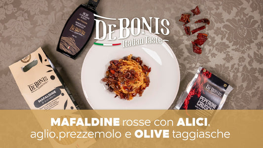 Mafaldine rosse con alici, aglio, prezzemolo e olive taggiasche